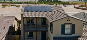 Two-story Phoenix home with rooftop solar panels installed for long-term energy savings and year-round efficiency