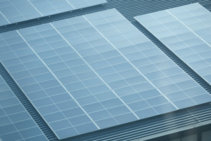 Large commercial solar panel system installed on a metal roof to reduce operating costs for businesses in Arizona
