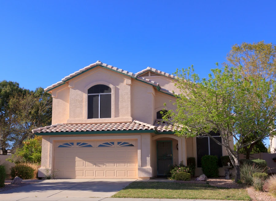 Two-story home with tile roof highlighting early warning indicators of roof damage in Phoenix, Arizona