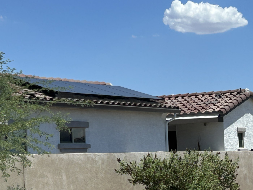 Phoenix home roofline with solar panels showing coordinated skylight planning and solar roof layout
