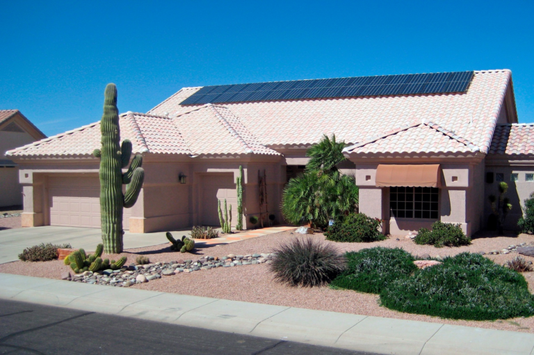 Phoenix residential home with rooftop solar panels showing solar-ready roofing and clean roof planning