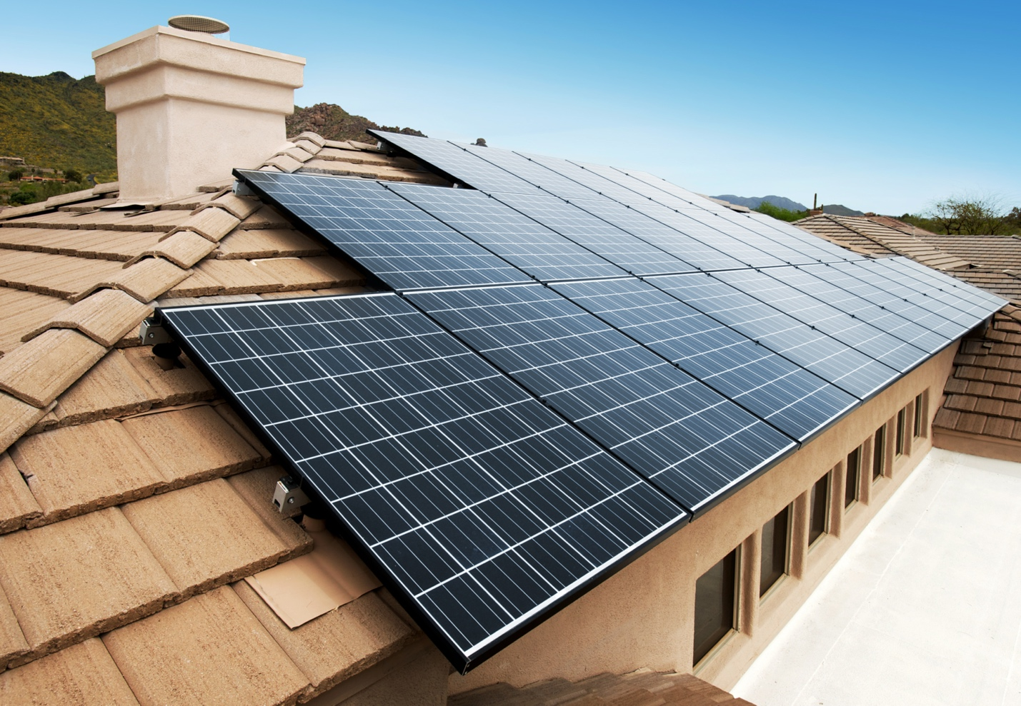 Why Paradise Valley Homeowners Are Rethinking Roof Ventilation and Natural Light a solar panel installation on a rooftop.