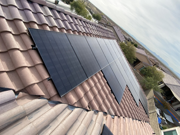 Tile roof with solar panels where attic ventilation planning supports comfort in a Phoenix home