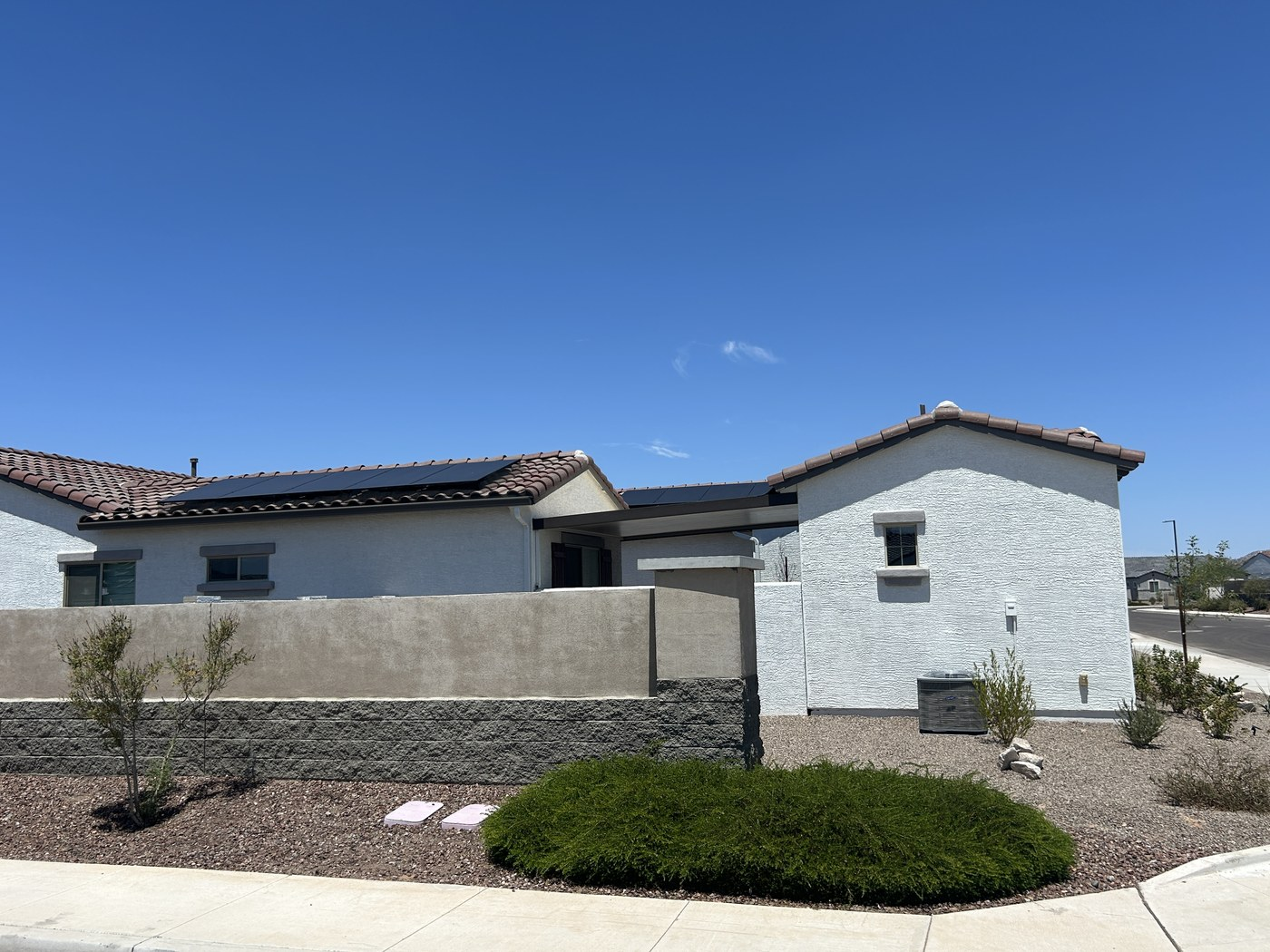 Why Skylight Planning for Solar Roofs in Phoenix, AZ Should Happen Together Residential roof with solar panels showing coordinated placement for daylighting and solar performance