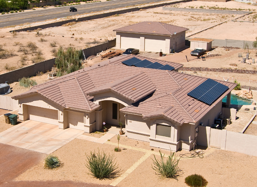 Aerial view of a growing Phoenix valley neighborhood with solar homes
