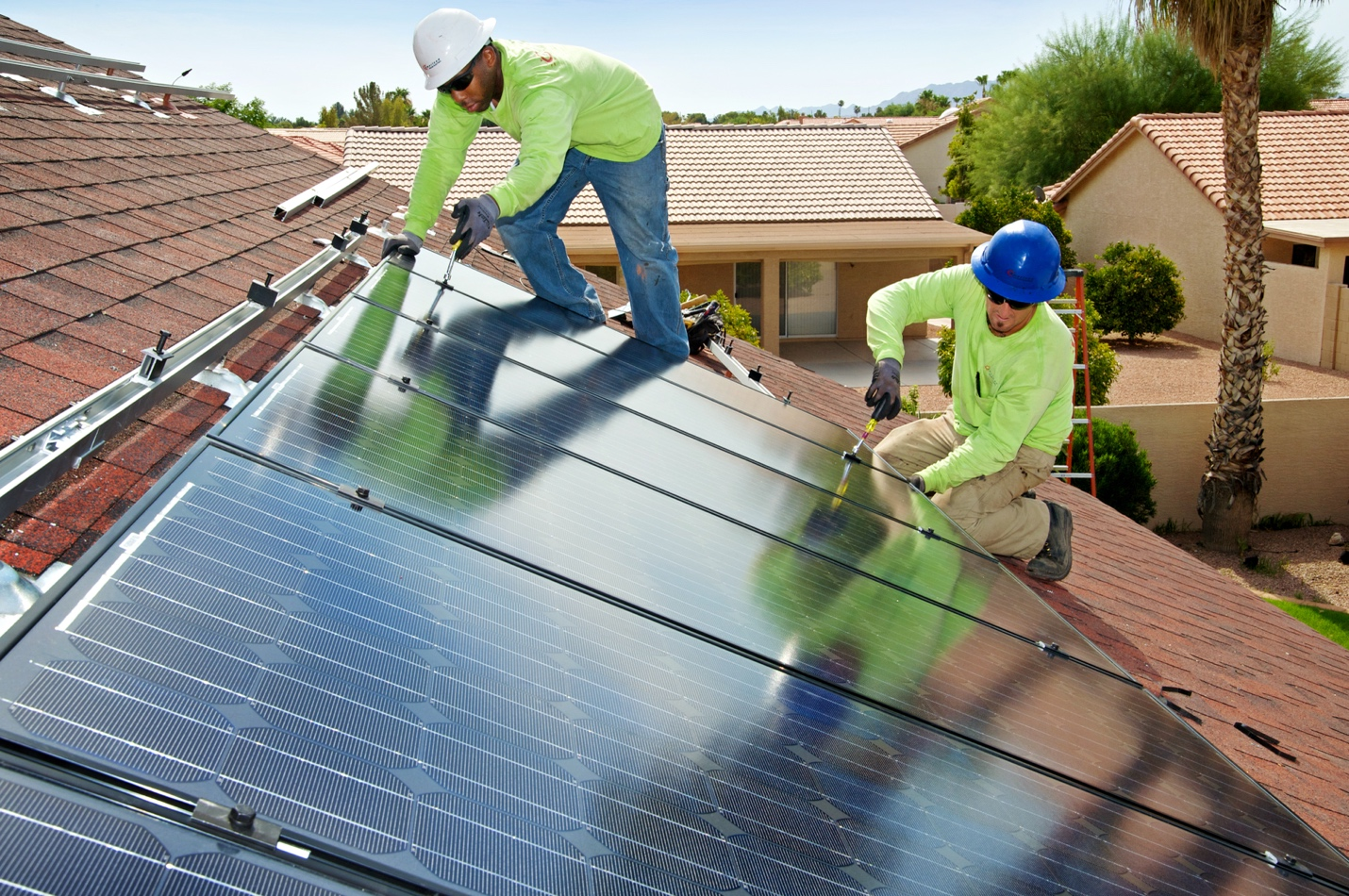 Solar Attic Fans: The Overlooked Roof Upgrade for Phoenix Homes solar panel contractors at work.
