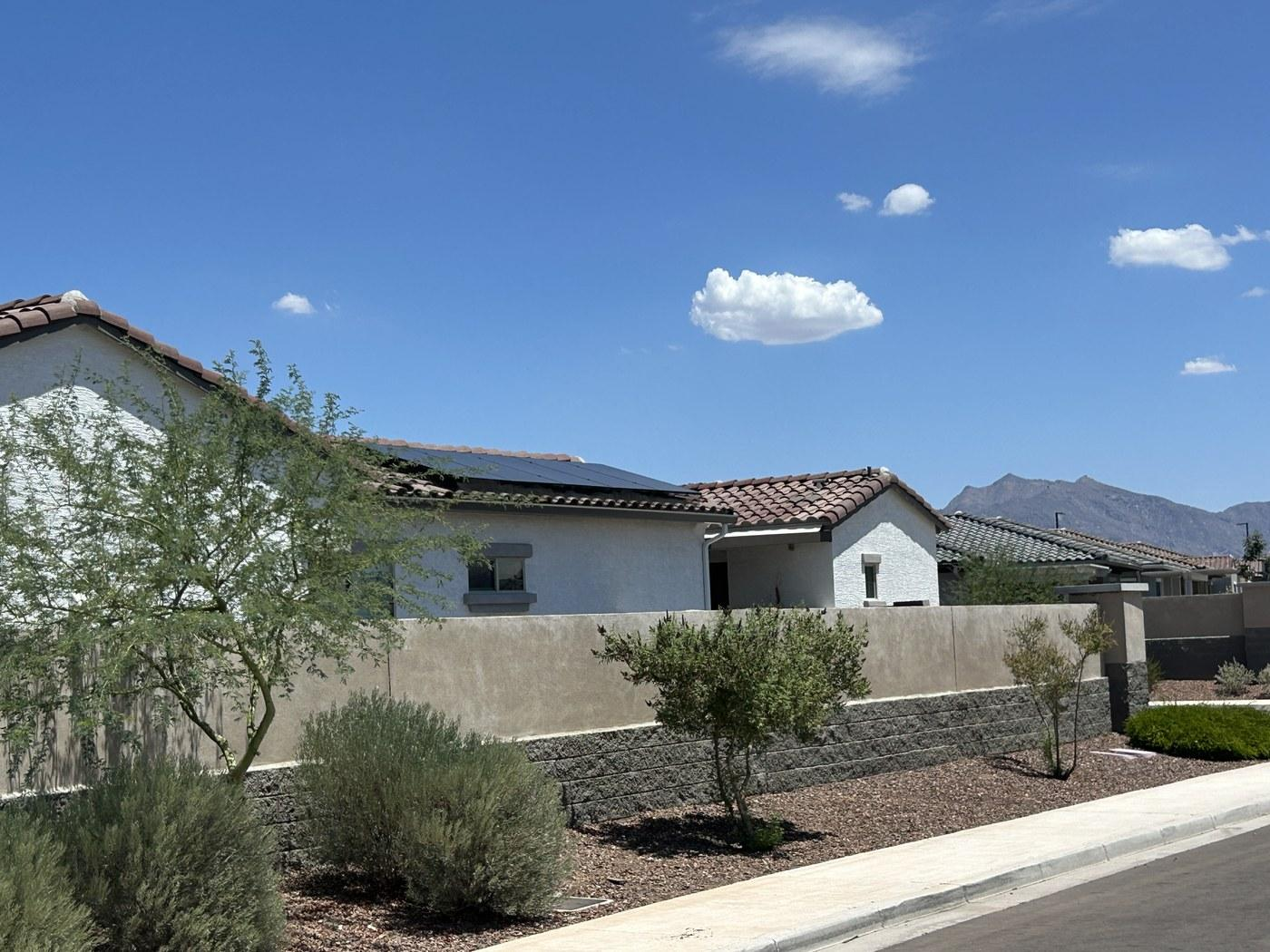 North Scottsdale home exterior with rooftop solar and desert landscaping.