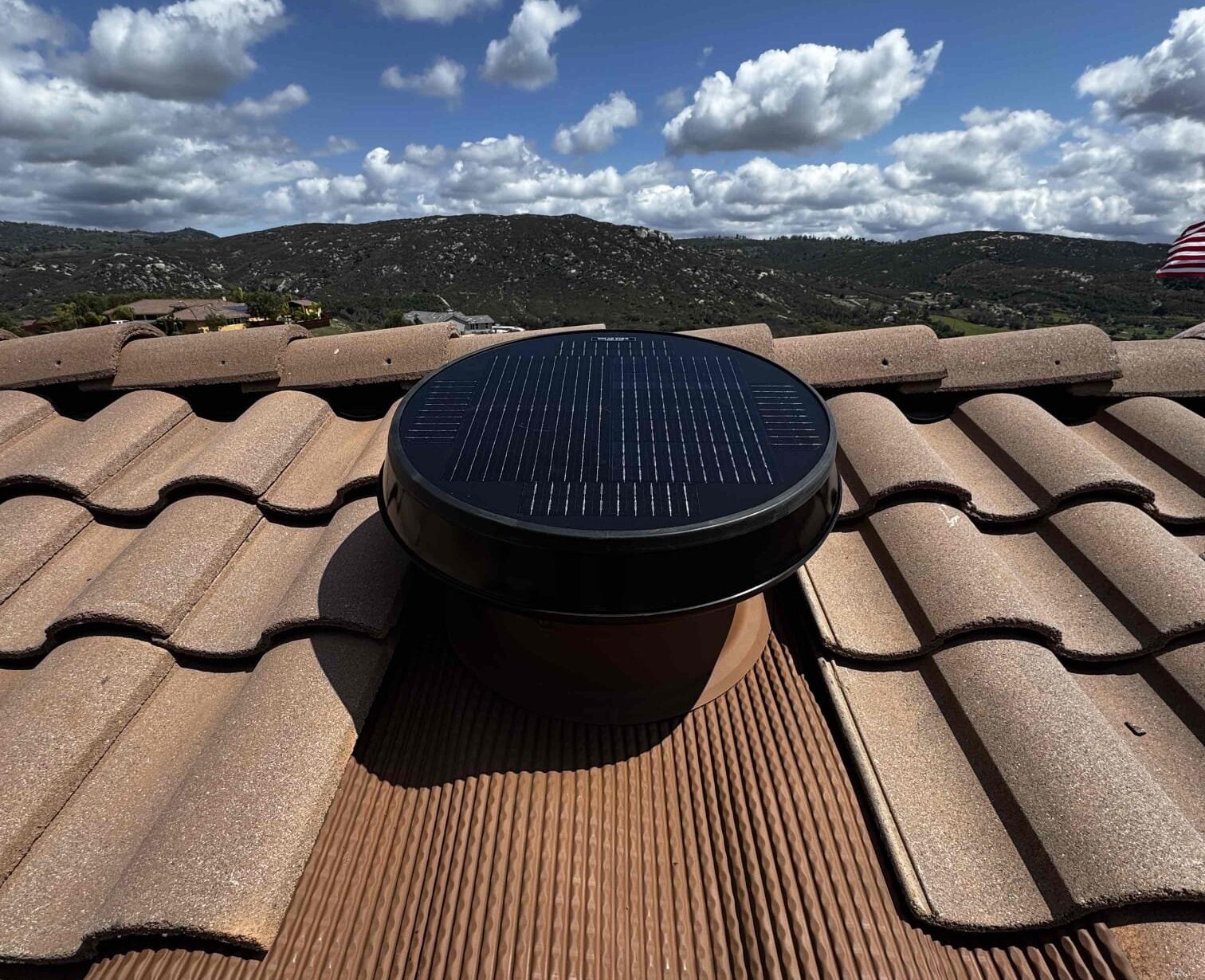 Why Attic Airflow Belongs in Your Solar Conversation Solar attic fan installed on an Arizona tile roof