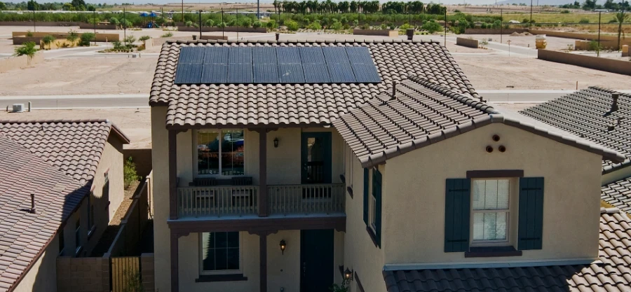 Two-story Phoenix home with rooftop solar panels installed for long-term energy savings and year-round efficiency