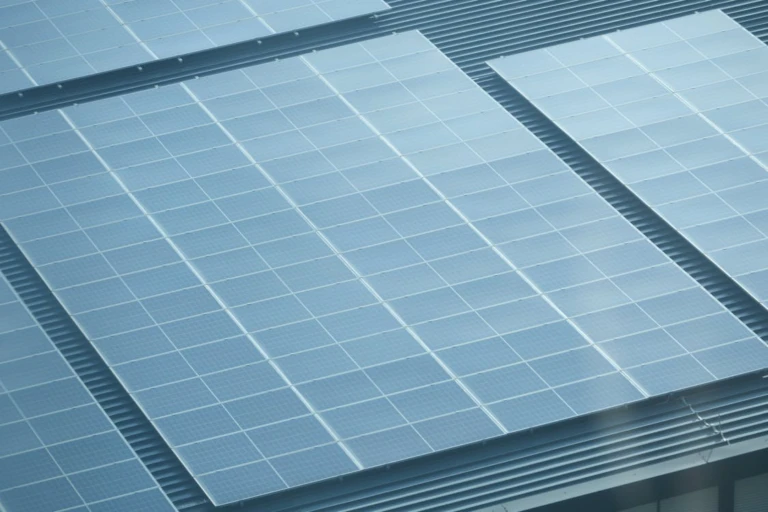 Large commercial solar panel system installed on a metal roof to reduce operating costs for businesses in Arizona